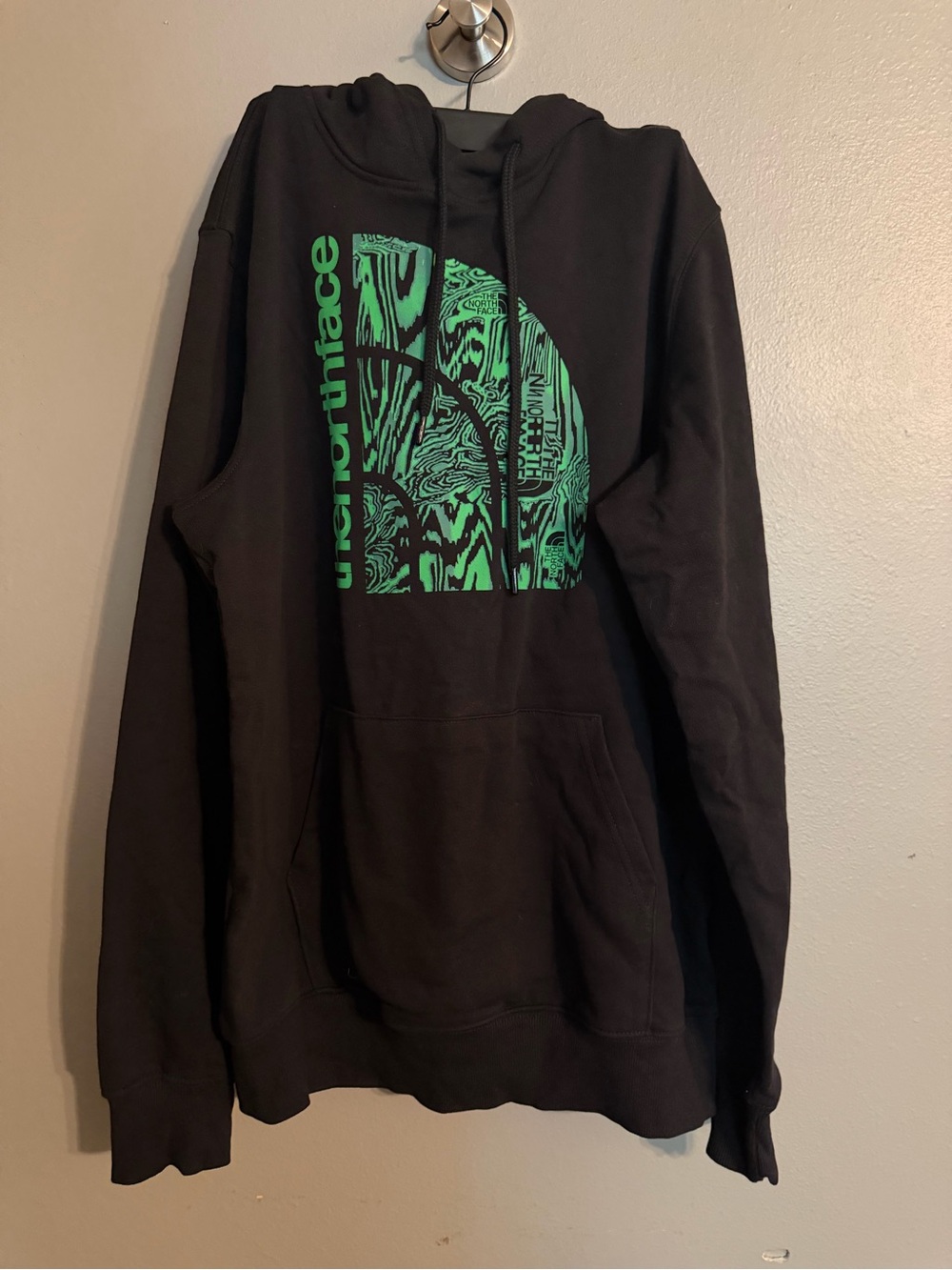 The North Face Black Hoodie with Green Graphic Logo